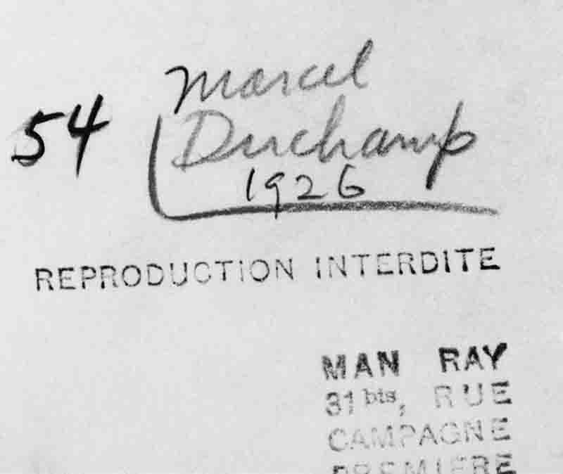 A close-up limited edition photograph of handwritten and typewritten text on a light background. The handwritten text at the top reads '54 Marcel Duchamp 1926' with a line underneath.